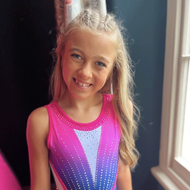 new-bestselling-leotards-lycra-neon- young gymnast in cute neon pink ombre and navy open back leotard