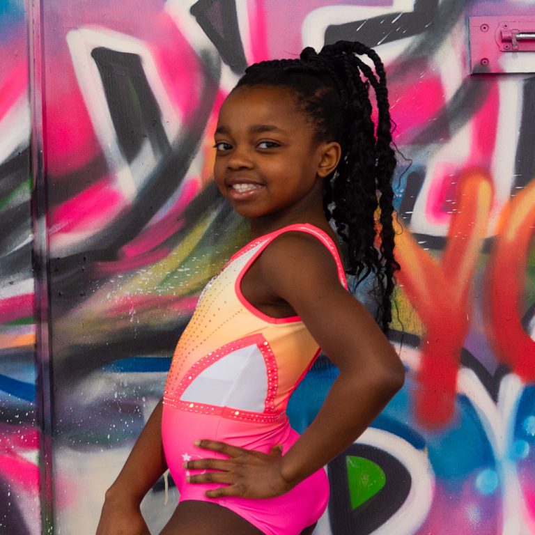 gymnasts wearing neon leotard photoshoot graffiti