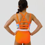 neon orange gymnastics sleeveless lycra leotard with retro swirly pattern and secure open back ab crystal scatter