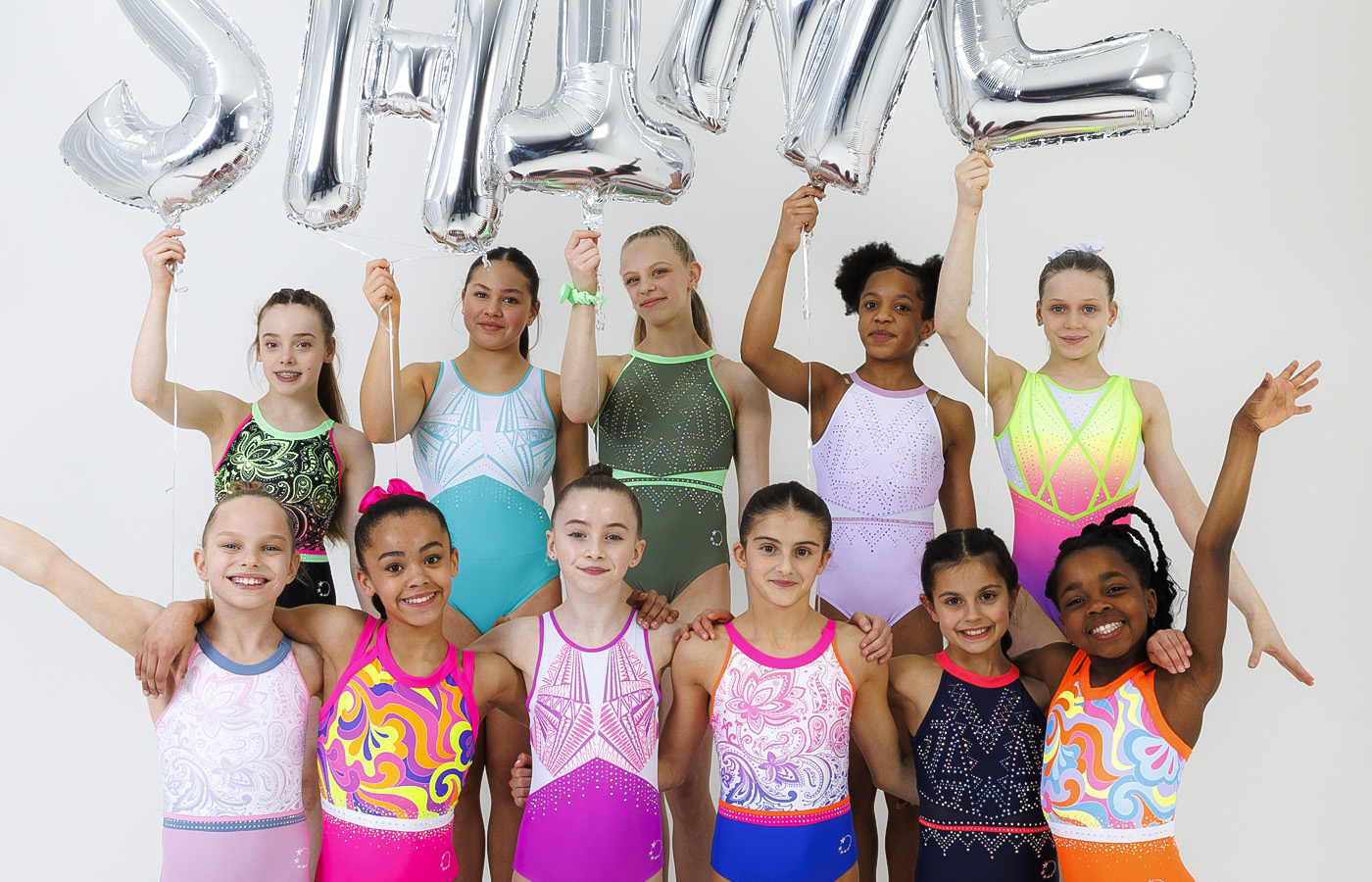 twelve new gymnastics leotards in vibrant neons and pastel ombre